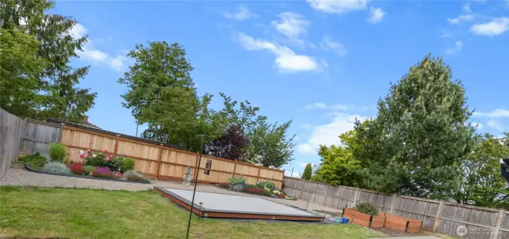 This backyard has room for all your outdoor hobbies- dining, yardening, sun worshipping, games, entertaining...