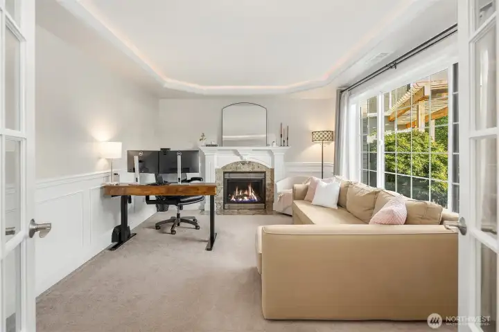 The great room is located near the entry and kept private, if you wish, by beautiful french doors. The great room is located near the entry and kept private, if you wish, by beautiful french doors.