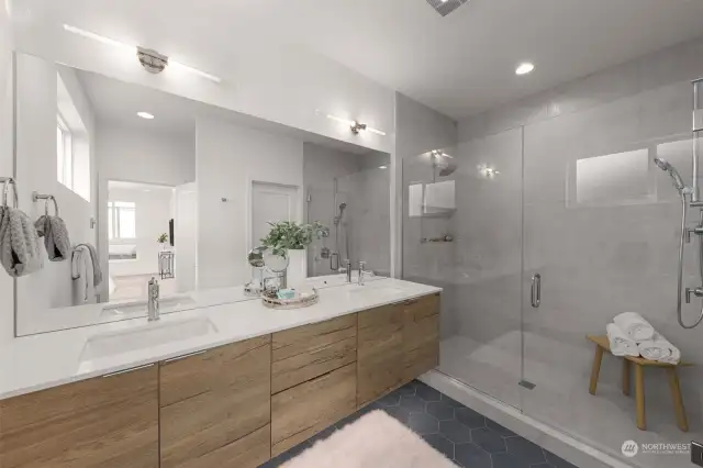 The stunning spa-like primary bathroom boasts gleaming quartz countertops, custom wood vanity & dual sinks, providing more space and convenience.