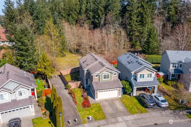 The propety behind this home is owned by the City of Maple Valley.  You can use it for walking and extercise.  It is like having a huge back yard.