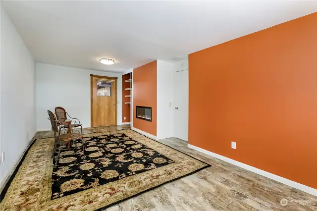 Second view of bonus room with door to backyard and deck areas