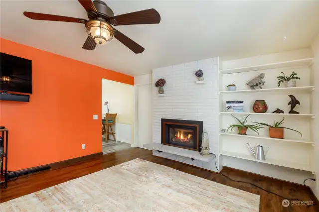 Nice deco-shelves beside comfy gas fireplace