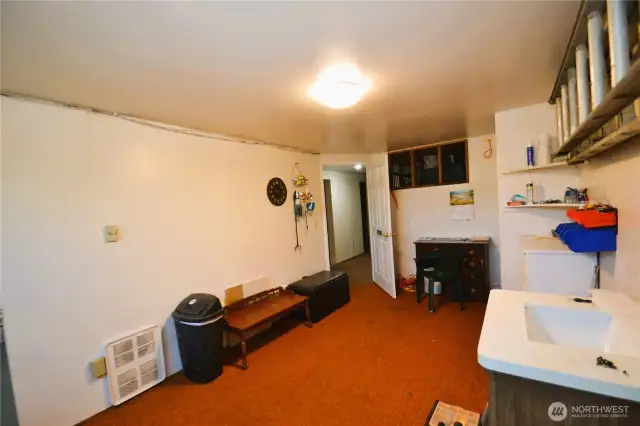 Another view of the office / work space in the basement