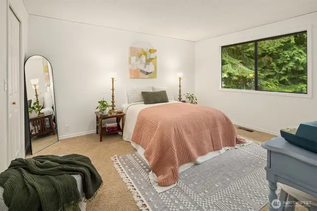 Main bedroom looks out over the backyard.