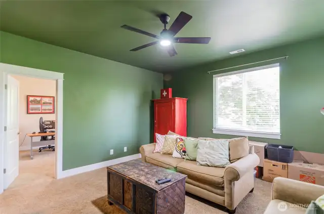 Check out this upstairs bonus room, with bedroom off to the left.