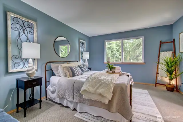 You'll love this main floor primary bedroom. Calm and serene.