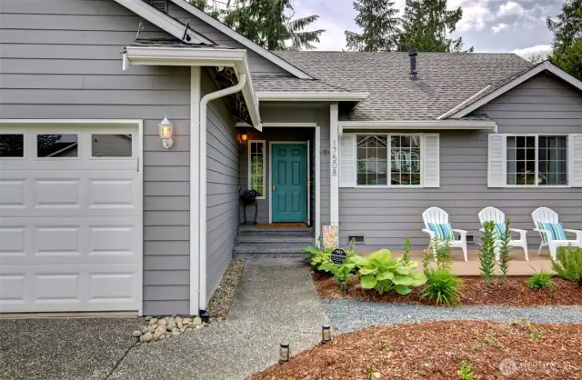 Lovely Entry with composite deck to sit and enjoy your landscaping.