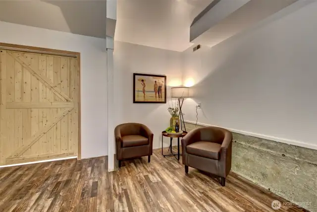 There is an additional room behind the barn door, formally used as a shop and has its own sub-panel!