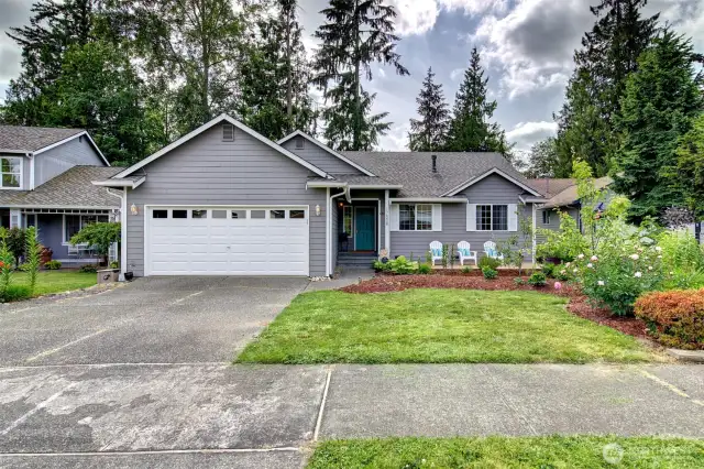 Beautiful landscaping and a variety of mature plants.