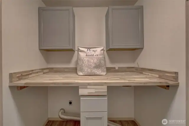 Main level laundry room with beautiful butcher block folding counter.