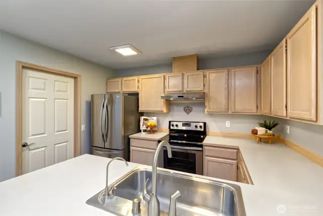 Main floor laundry room located next to kitchen.