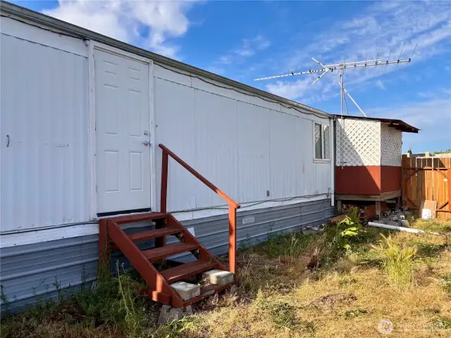 Side yard with second entry.