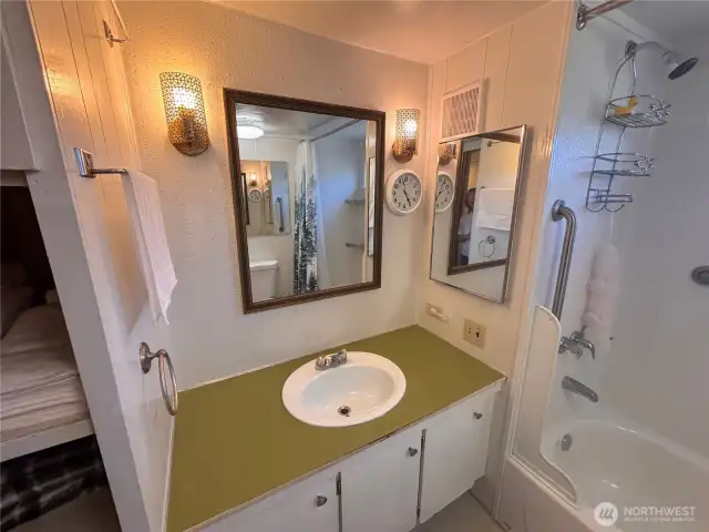 Bathroom with nice size tub, added grab bars for safety