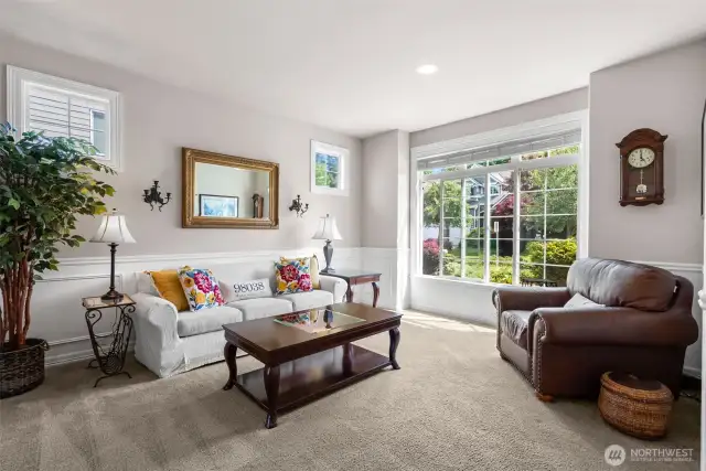 Bright and airy living room right off of the entrance