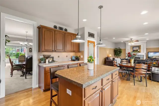 The kitchen offers a walk in pantry and flows seamlessly into the nook and family room.