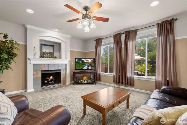 Large windows let in so much natural light plus a gas fireplace help to make this family room the hub of the home.