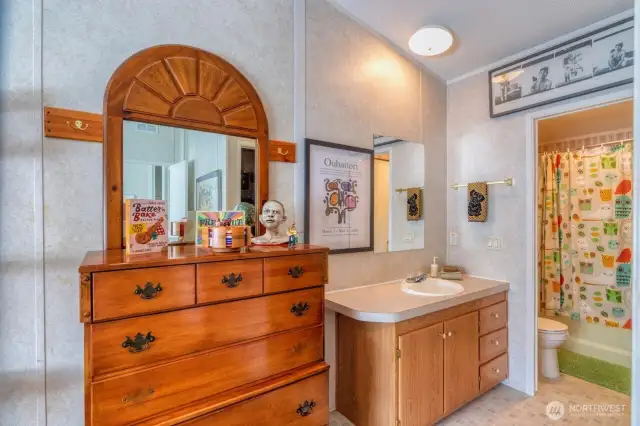 Vanity, sink with separate full bath.