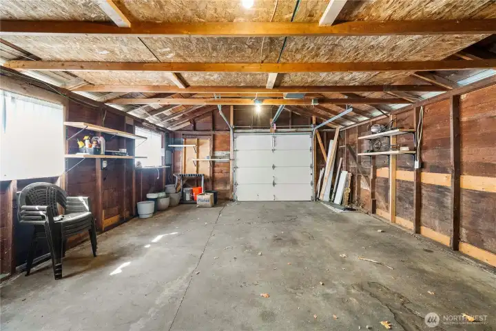 Detached 1 car garage has tons of space for storage and is wired for power.