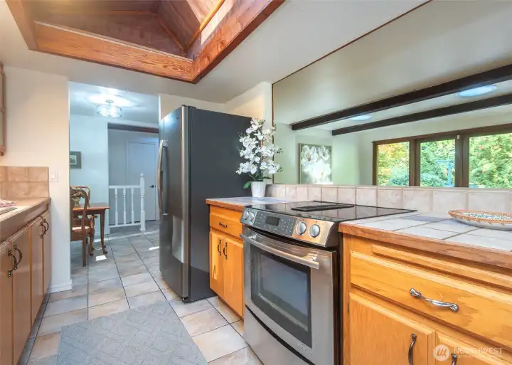 Kitchen looking to dining space and living room.