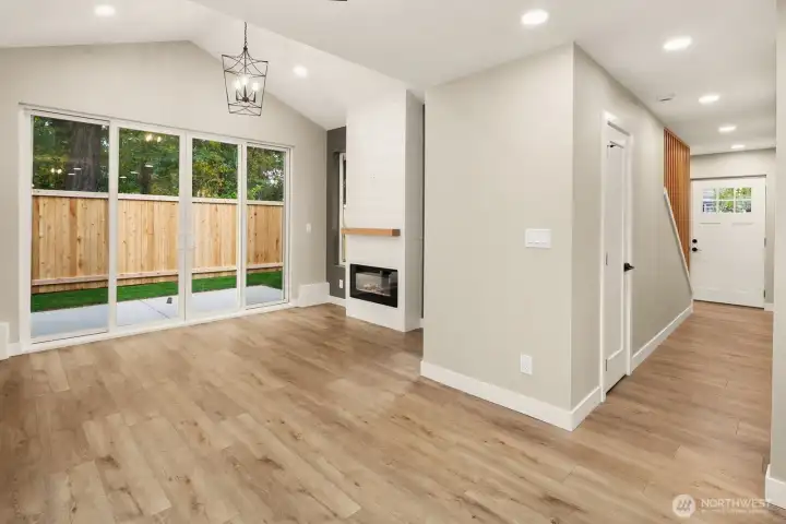 Home boasts open floor plan with vaulted 8ft+ ceilings.