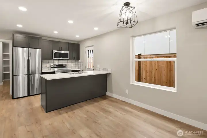 Luxury kitchen with eating bar and kitchen  dining space.