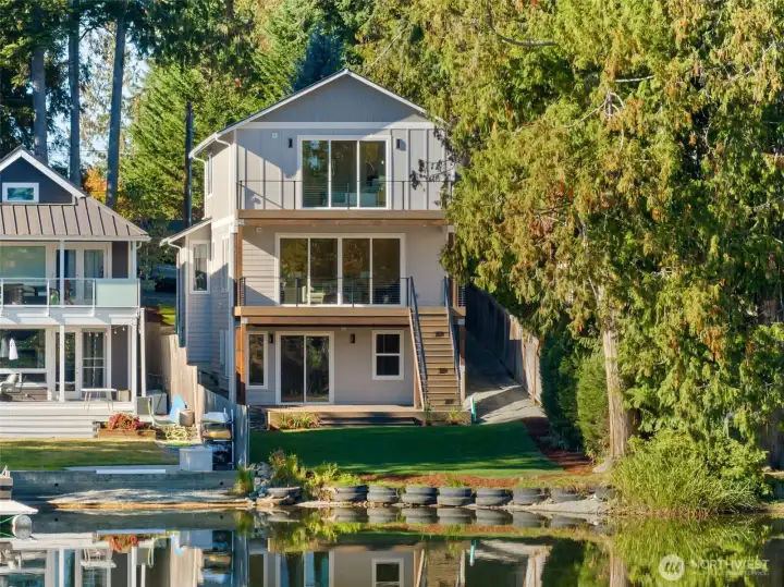 The exterior showcases timeless architecture with clean lines and sophisticated materials. From the moment you arrive, the craftsmanship and attention to detail are noteworthy.