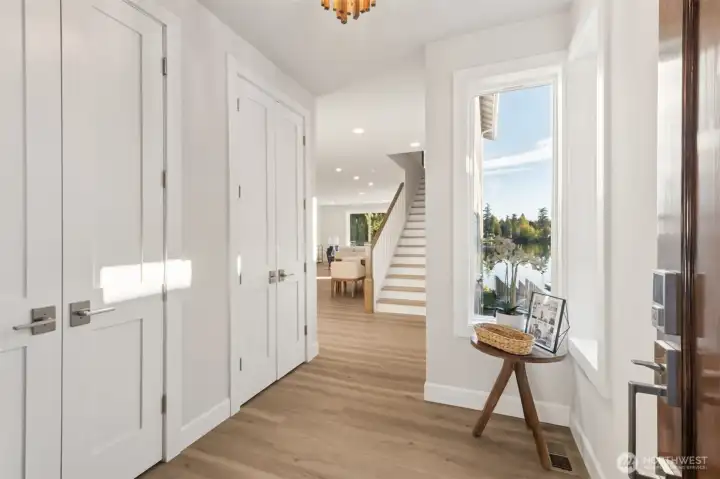 Step inside through the welcoming foyer where natural light pours in, setting the tone for the home’s warm and refined aesthetic. High ceilings and quality finishes immediately convey a sense of calm and sophistication.