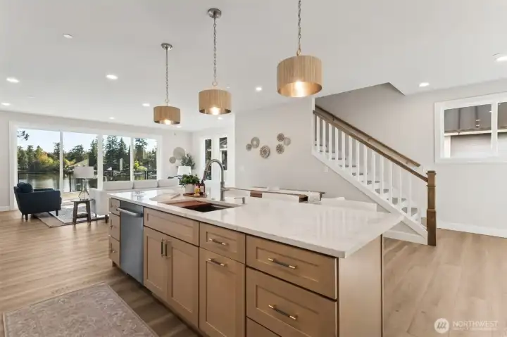 Throughout the home, hand-selected light fixtures add refinement and personality. Each space glows with warmth, enhancing the modern yet timeless ambiance. Hand picked details throughout make this custom home such a rare find.