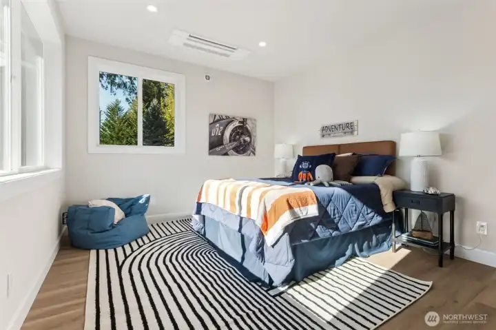 The generous bedrooms enjoy their own walk-in closets and climate control for maximum comfort year round.