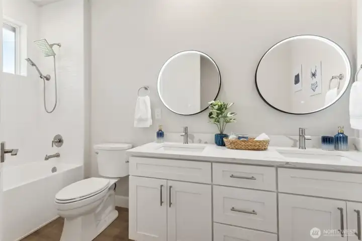 A stylish ensuite bath features designer tilework and sleek fixtures including lighted mirrors with anti-fog technology.  You will enjoy the sense of privacy and comfort it provides.