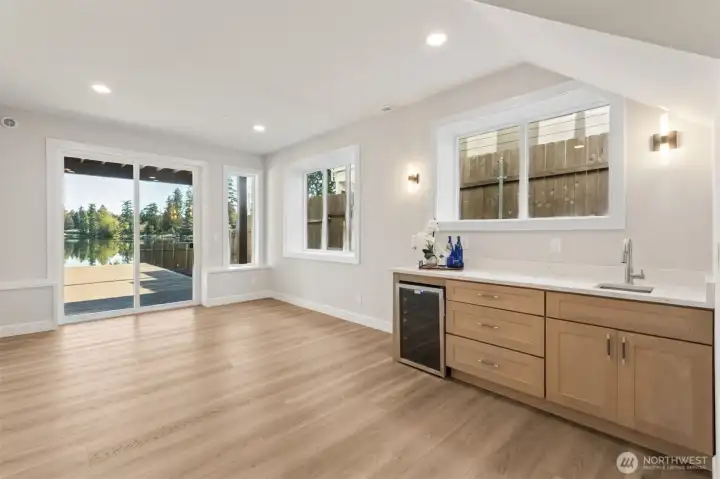 Lower level with wet bar and beverage fridge. A great space to host Summer gatherings or second living area with a 4th bedroom and large 3/4 bath.