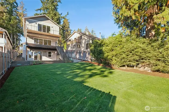 The grounds are thoughtfully designed to enhance the natural surroundings. Lush grass, mature greenery and soft plantings provide color, texture, and year-round enjoyment. Three decks provide additional outdoor spaces to relax and enjoy or entertain.