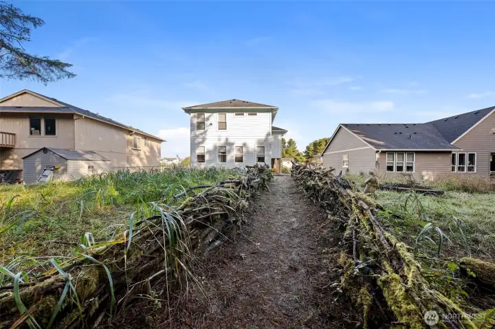 Back yard with natural low maintenance landscaping