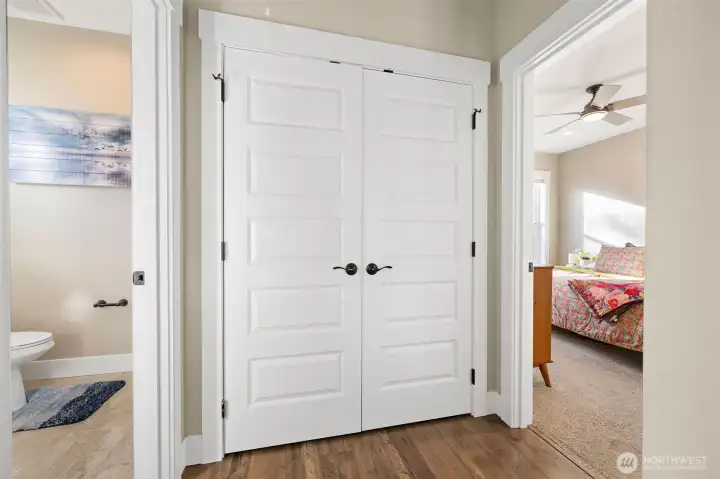 Upper floor bathroom, laundry and Primary Suite