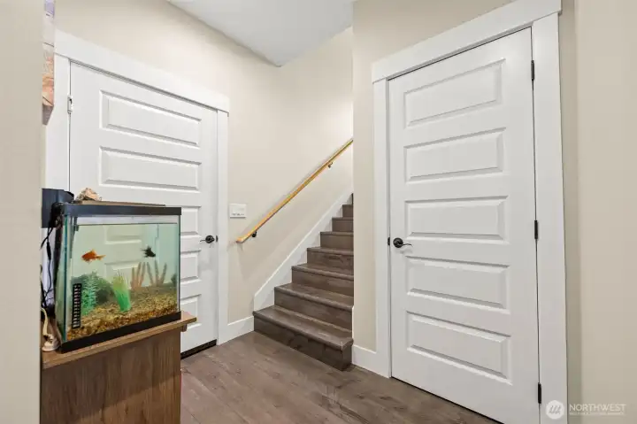 Main floor stairway. Door 1 goes to the garage, door 2 is a closet