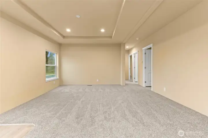 Spacious living room with canned lighting.
