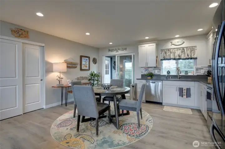 Kitchen also leads out to enclosed sunroom.