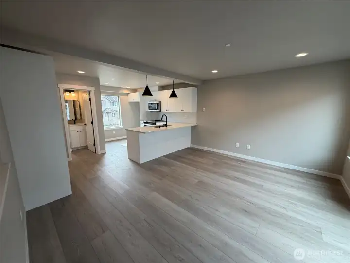 Subject property. Open kitchen/living floor plan. Door to the left is the powder room