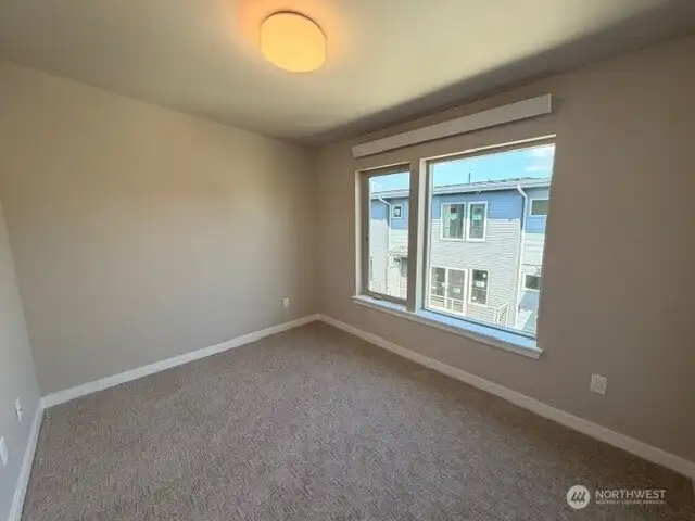 Subject property. 2nd bedroom flooded with natural light