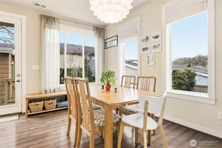 Windows surround this charming dining room with access to backyard where a gas line is directly plumbed to BBQ for easy entertaining.