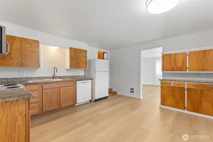 All new LVP flooring. Large kitchen with room for island