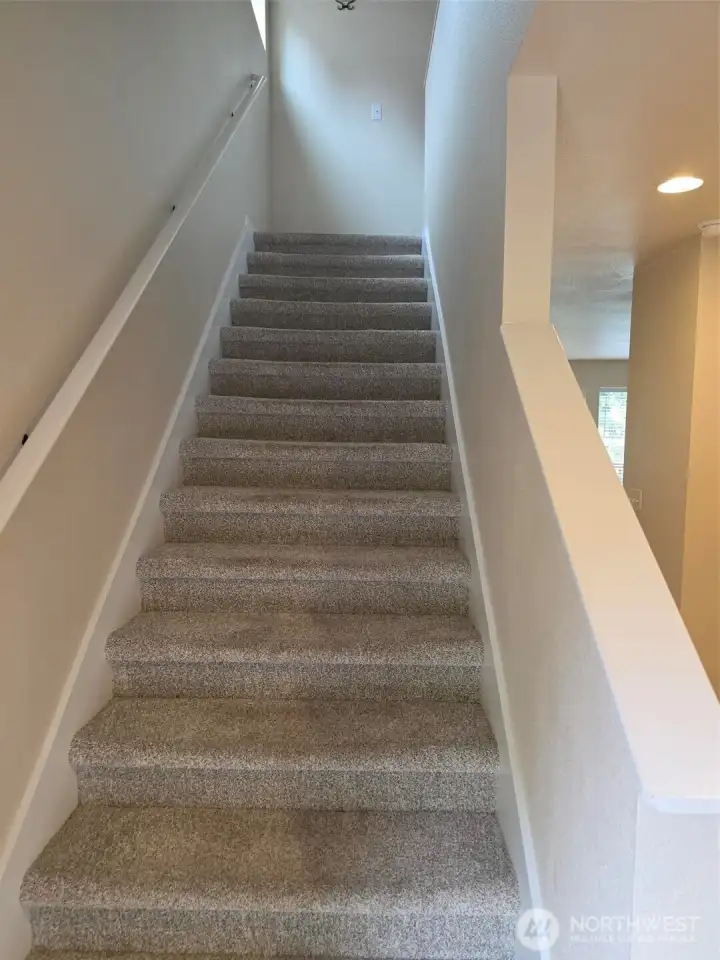Stairs from entry to Upper floor . Hallway to Living Room/Kitchen to right Stairs from entry to Upper floor . Hallway to Living Room/Kitchen to right