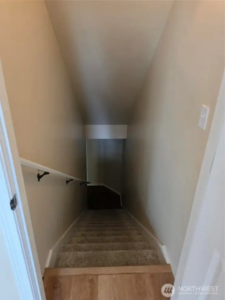 Stairway to Family room and outdoor patio Stairway to Family room and outdoor patio