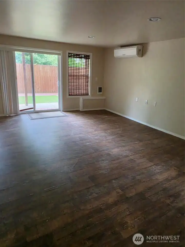 Family Room and slider door to outside patio (Partially covered for rainy days. Family Room and slider door to outside patio (Partially covered for rainy days.