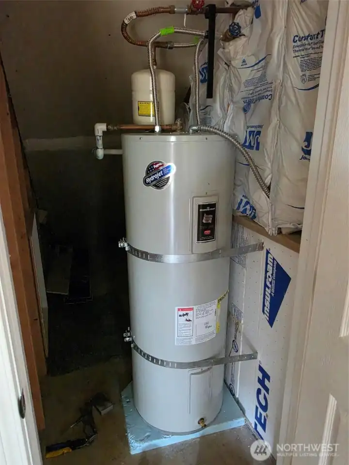 Under stairs hot water heater closet. Under stairs hot water heater closet.