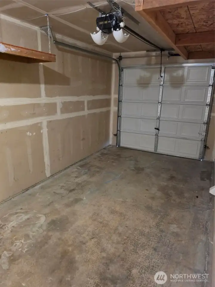 Garage from door of main hallway to living room kitchen area. Garage from door of main hallway to living room kitchen area.