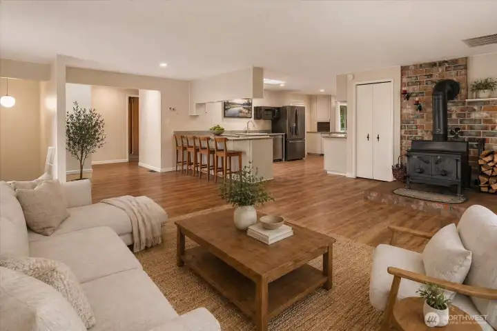 Family room just off the kitchen with cozy wood-burning stove...(virtually staged) Family room just off the kitchen with cozy wood-burning stove...(virtually staged)
