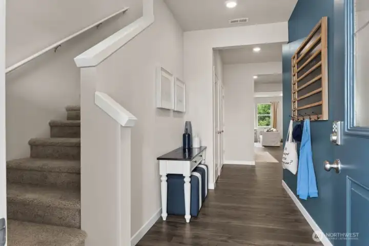 Wide bright hallways. Photo rendering is representational and may be virtually staged. Actual home is under construction and finishes, elevation, and paint colors may vary. See site agent for details. Wide bright hallways. Photo rendering is representational and may be virtually staged. Actual home is under construction and finishes, elevation, and paint colors may vary. See site agent for details.