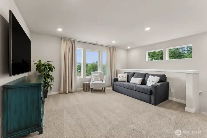 Loft at the top of the stairs. Photo rendering is representational and may be virtually staged. Actual home is under construction and finishes, elevation, and paint colors may vary. See site agent for details. Loft at the top of the stairs. Photo rendering is representational and may be virtually staged. Actual home is under construction and finishes, elevation, and paint colors may vary. See site agent for details.