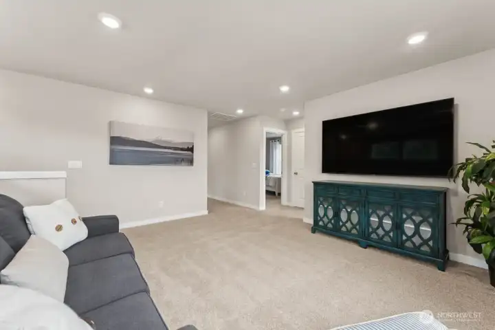 Expansive loft upstairs providing additional gathering space. Photo rendering is representational and may be virtually staged. Actual home is under construction and finishes, elevation, and paint colors may vary. See site agent for details. Expansive loft upstairs providing additional gathering space. Photo rendering is representational and may be virtually staged. Actual home is under construction and finishes, elevation, and paint colors may vary. See site agent for details.